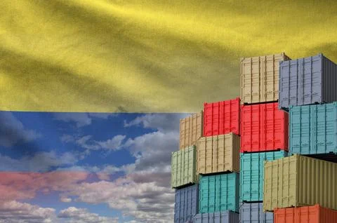 Colombia flag and big stack of shipping cargo containers in docks with sky イラスト素材