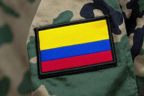 Colombian flag patch on camouflage Stock Photos