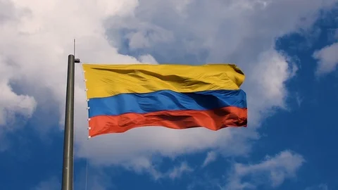 Colombian flag in strong wind and big clouds in background Stock Footage 101212026