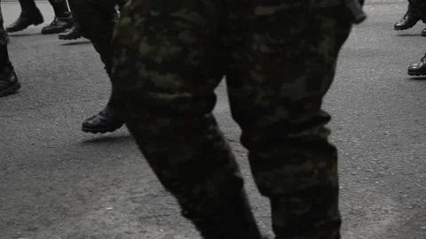 Colombian soldiers marching to war, Armed troops advancing through rural terrain Stock Footage 315193853