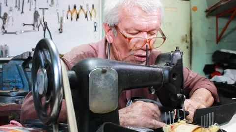 A colombian upholsterer working on a sewing machine Stock Footage 304713898