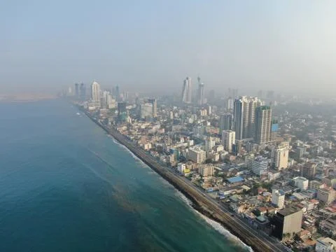Colombo city captured while flying off the coast on a misty morning 库存照片