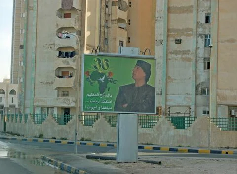 Colonel Gaddafi billboard by run down apartments, Tripoli, 2006 Stock Photos