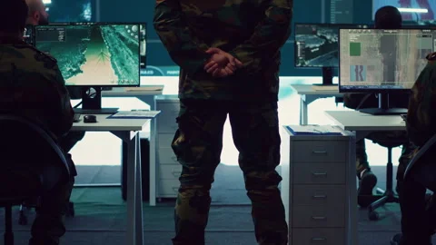 Colonel overseeing special operation to gather intelligence in control center Stock Footage 276921814