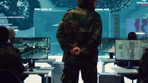 Colonel overseeing special operation to gather intelligence in control center Stock Photos