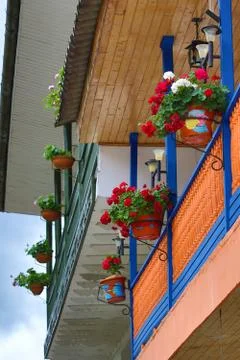 Colonial balcony with flower Stock Photos