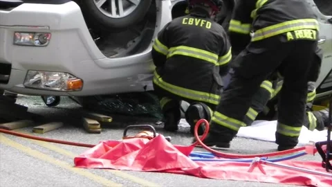 Colonial Beach VA US 7-4-2014 Overturned Car Firefighters Remove Passenger Part4 Stock Footage 150384199