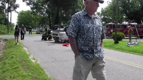 Colonial Beach VA US 7-4-2014 Overturned Car Firefighters Remove Passenger Part6 Stock Footage 150386634