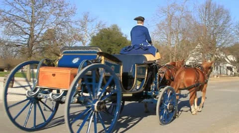 Colonial carriage passes down the road Stock-Footage 10828093