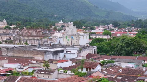 Colonial Cathedral and Red Tile Rooftops in Historic Town with Mountain. Stock Footage 338363736