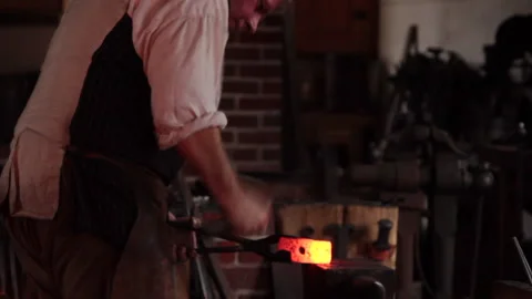 Colonial Early Century Blacksmith with Fire, Pounding Iron. Jamestown, Plymouth Stock-Footage 203981376