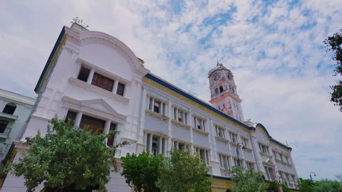 Colonial-era clock tower building in Georgetown Penang Island with cloudy sky Stock Footage 344430158