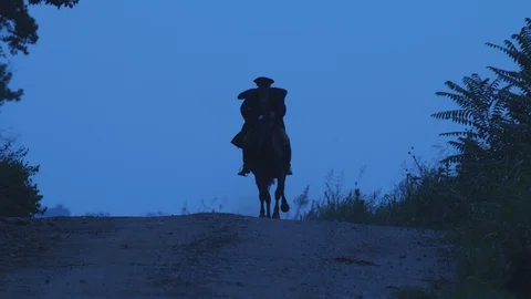 Colonial Horseman Rides Down Dirt Road - Paul Revere Stock Footage