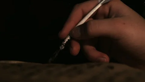 Colonial man writes with a quill on parchment Stock Footage 101112640