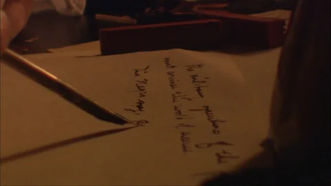 Colonial Man Writes With Quill At Table By Candle Light Stock Footage 92083403