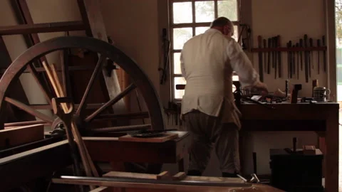 Colonial Minuteman working as a Gunsmith on a flintlock - American Revolution Stock Footage 203981666
