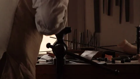 Colonial Minuteman working as a Gunsmith on a flintlock - American Revolution Stock Footage 203981833