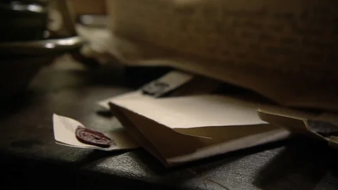 Colonial papers on Table by candle light &amp; by window Stock Footage 81227874