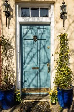 A colonial style front door with an eccentric door frame Photos