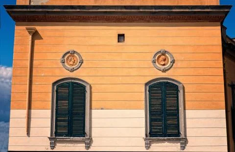 Colonial wall with windows. Stock Photos