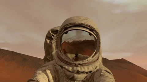 Colony on Mars. Astronaut sitting on Mars and admiring the scenery. Exploring Stock Footage 112524499
