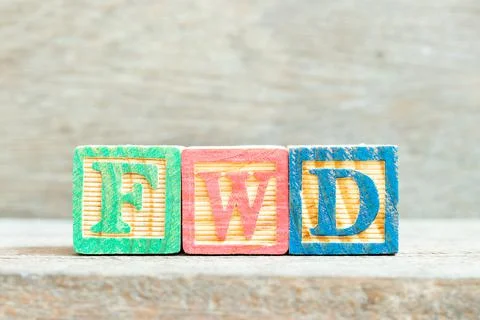 Color alphabet letter block in word FWD (Abbreviation of forward)  on wood ba Stock Photos