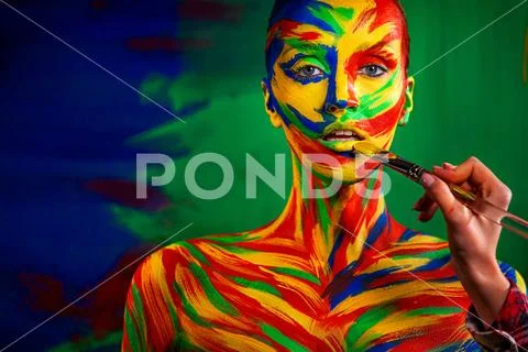 Color art face and body painting on woman for inspiration. Abstract portrait of Stock-Fotos