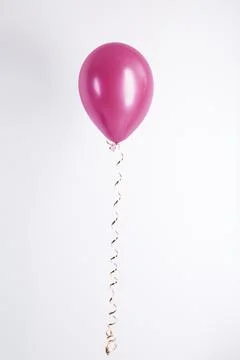 Color balloon with ribbon on white background Stock Photos