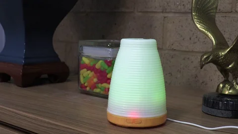 Color Changing Essential Oil Diffuser in an Office Setting. Stock Footage 127735134