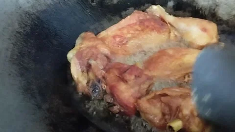 The color of the chicken that has been turned over while in the pan Stock Footage 212499566