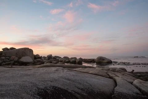 Color cloud formations at sunset over the water Foto stock