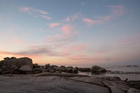 Color cloud formations at sunset over the water Stock Photos