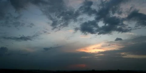 Color cloudy sunset panoramic view Stock Photos