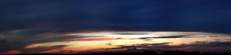 Color cloudy sunset panoramic view Stock Photos