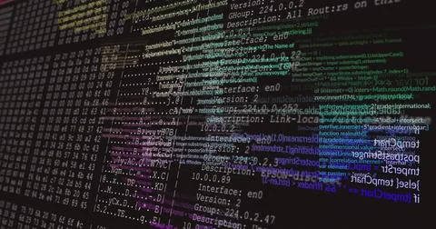 Color-coded code, network config and hex dumps appearing on monitor at desk, Stock Illustration