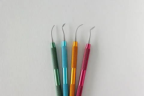 Color coded dental composite instruments for restorative procedures Stock Photos