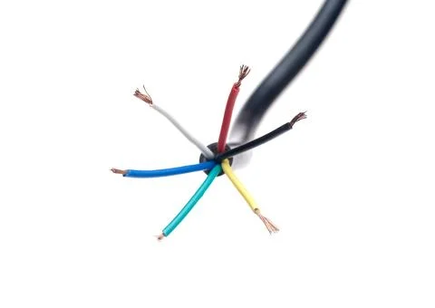 Color coded electric wire over white background Foto stock