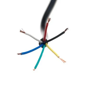 Color coded electric wire over white background Foto stock