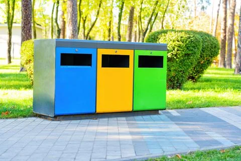 Color coded garbage bins in a public park 스톡 사진