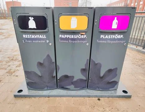 Color-coded recycling bins for sorting Photos