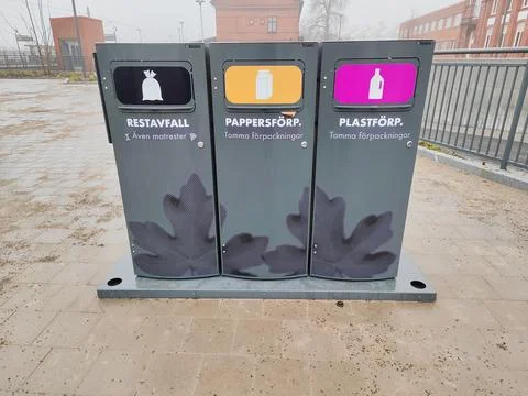 Color-coded recycling bins for sorting Photos