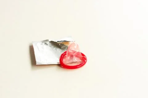 Color condom on white background Stock Photos