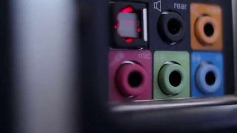 Color connectors in computer. Connection of the wire headphone to the PC Stock Footage 75989309