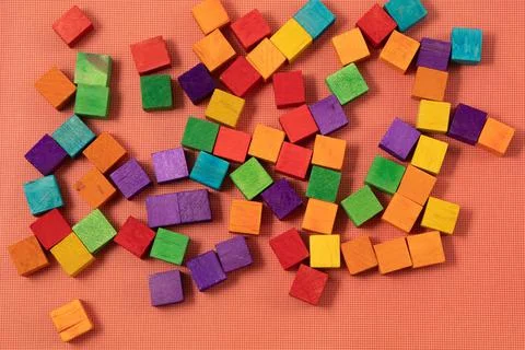 Color cubes close-up. The concept of creativity. red background Stock Photos