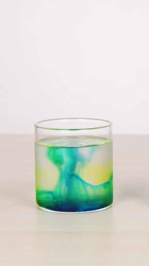 Color Diffusion in Water Glass Science Experiment Timelapse Stock Footage 318719700