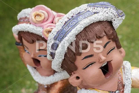 Color dolls in garden. Stock Photos