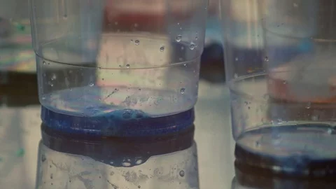 Color Dye in Cups Getting ready to Dye Easter Eggs Stock Footage 79733763