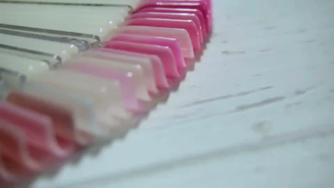 Color examples of nails in the salon manicure Stock Footage 98044116