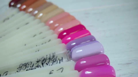 Color examples of nails in the salon manicure Stock-Footage 98044293