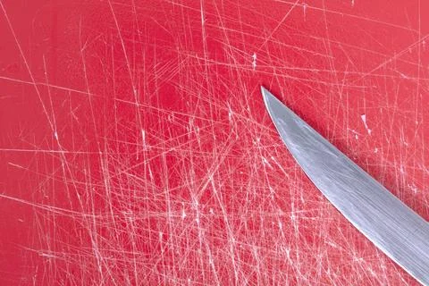 Color gradient red old plastic cutting board background with scratches Stock Photos